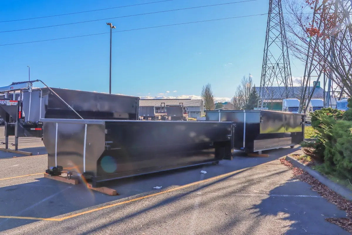 Roll-off dumpster ready for waste disposal at job site for Roofing Dumpster Rental in Rindge